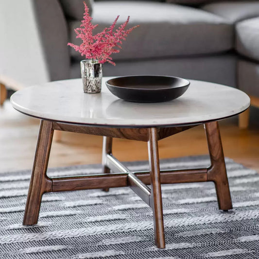 Gallery Barcelona coffee table with a smooth white marble top mounted on a warm solid acacia wood base in a mid-century styled living room.