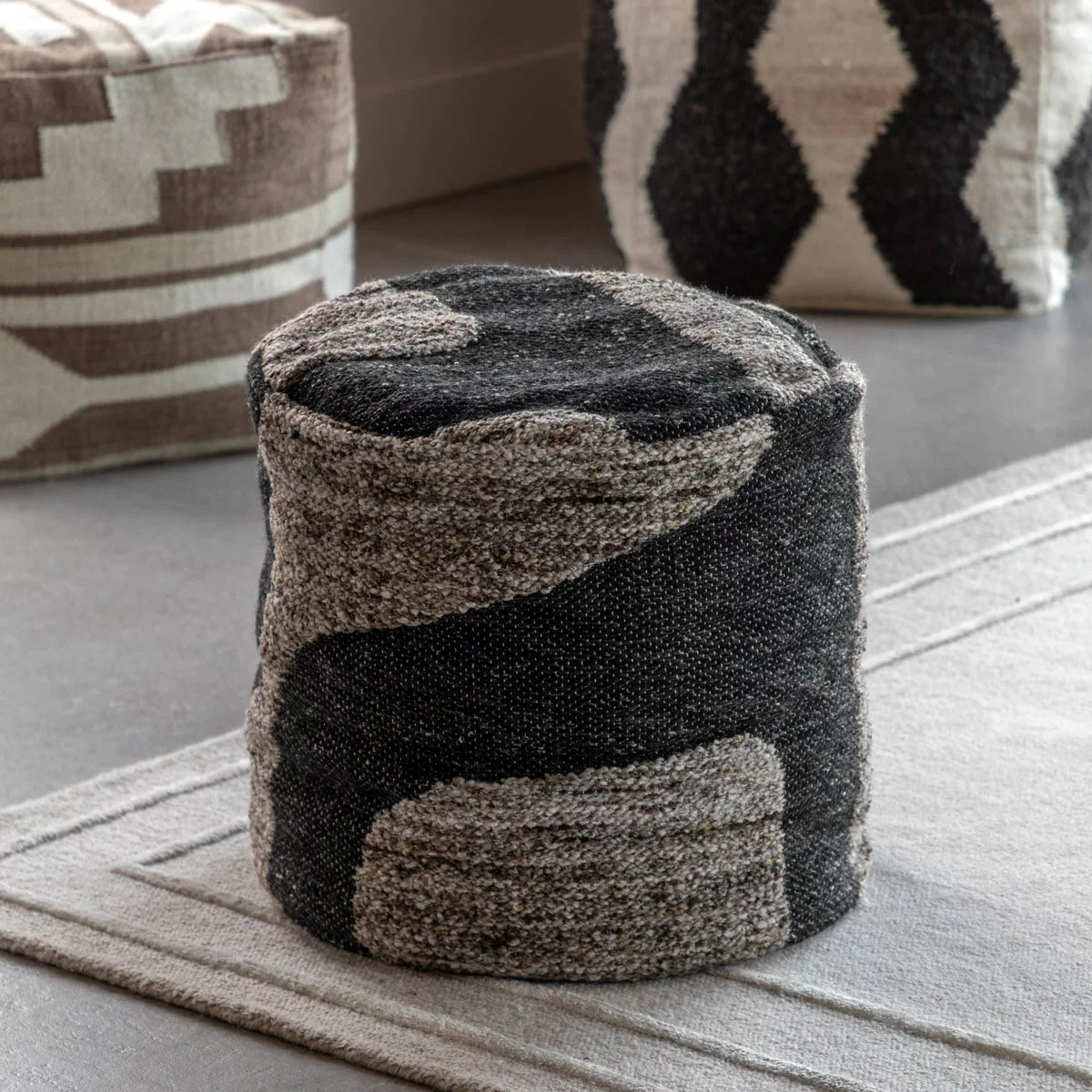 Gallery Bergen Mono Graphic Drum Pouffe with contemporary black and white pattern in a modern living room