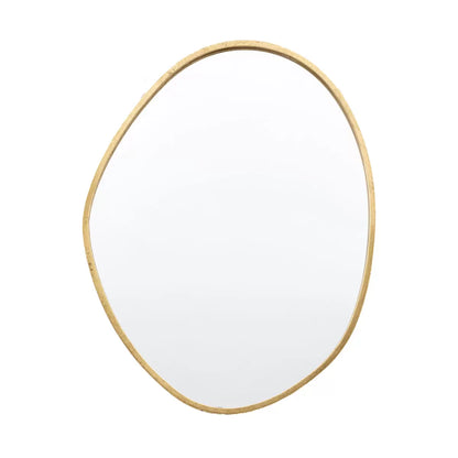 Vertical Gallery Chattenden gold pebble mirror mounted on a neutral living room wall reflecting natural light.