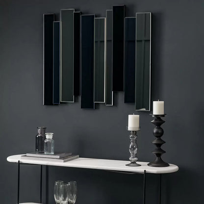 Gallery Duval Art Deco grey smoked mirror with layered multi-tinted clear and black glass panels mounted vertically on a neutral hallway wall.