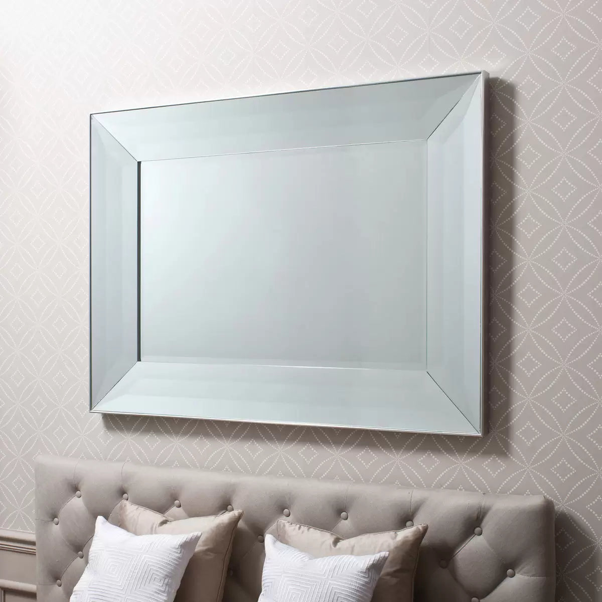Gallery Ferrara rectangular mirror measuring 91 by 122 cm with a wide bevelled mirror frame and silver edge mounted horizontally above a neutral hallway console table.