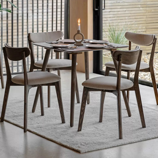 Gallery Hatfield Smoked Square Dining Table with smoked wood finish seating four people in a modern dining room