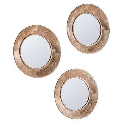 Gallery Knowle Mirror Trio set with slim black iron frames mounted on a textured interior wall reflecting warm daylight.