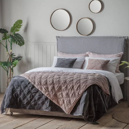 Oversized Gallery quilted cotton velvet bedspread in charcoal grey styled beautifully across a modern king size bed