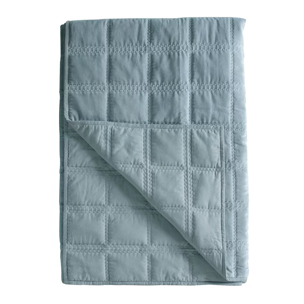 Oversized Gallery quilted cotton velvet bedspread in charcoal grey styled beautifully across a modern king size bed