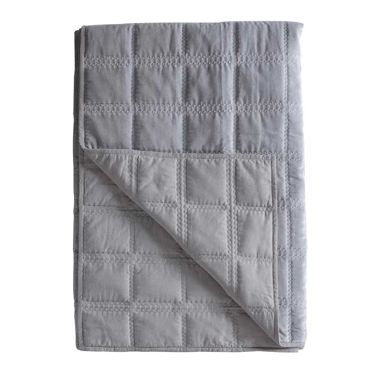 Oversized Gallery quilted cotton velvet bedspread in charcoal grey styled beautifully across a modern king size bed