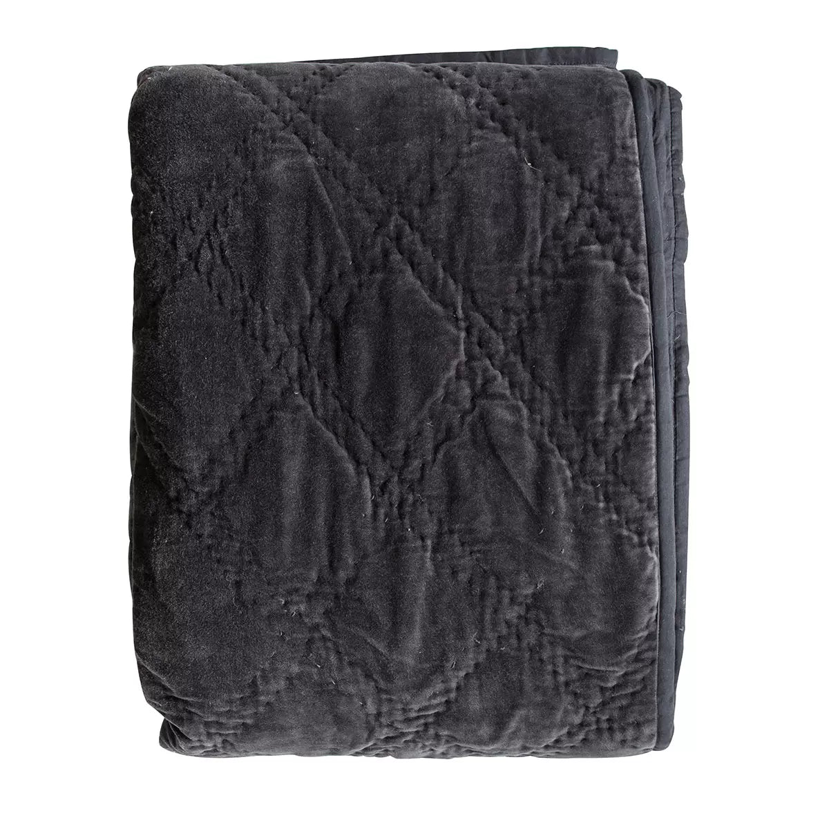 Oversized Gallery quilted cotton velvet bedspread in charcoal grey styled beautifully across a modern king size bed