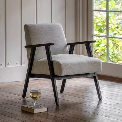 Mottled stone linen armchair with cushioned seat and solid wood frame for modern living room interiors