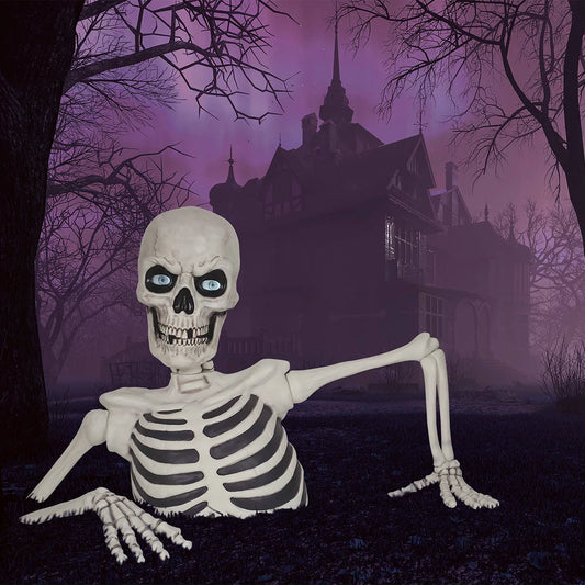 A massive 5-foot gray and bone-white ground breaking skeleton prop with glowing red LCD eyes appearing to burst out from green lawn grass at night.