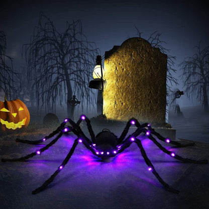 Angle view of a 2.9ft giant black hairy spider decoration with glowing red LED eyes crouching on a dark background.