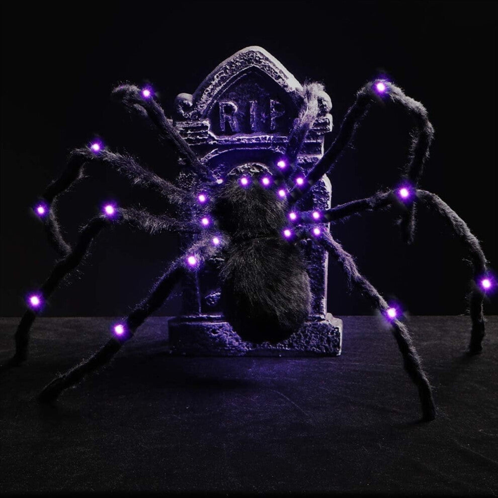Angle view of a 2.9ft giant black hairy spider decoration with glowing red LED eyes crouching on a dark background.