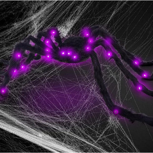 Angle view of a 2.9ft giant black hairy spider decoration with glowing red LED eyes crouching on a dark background.
