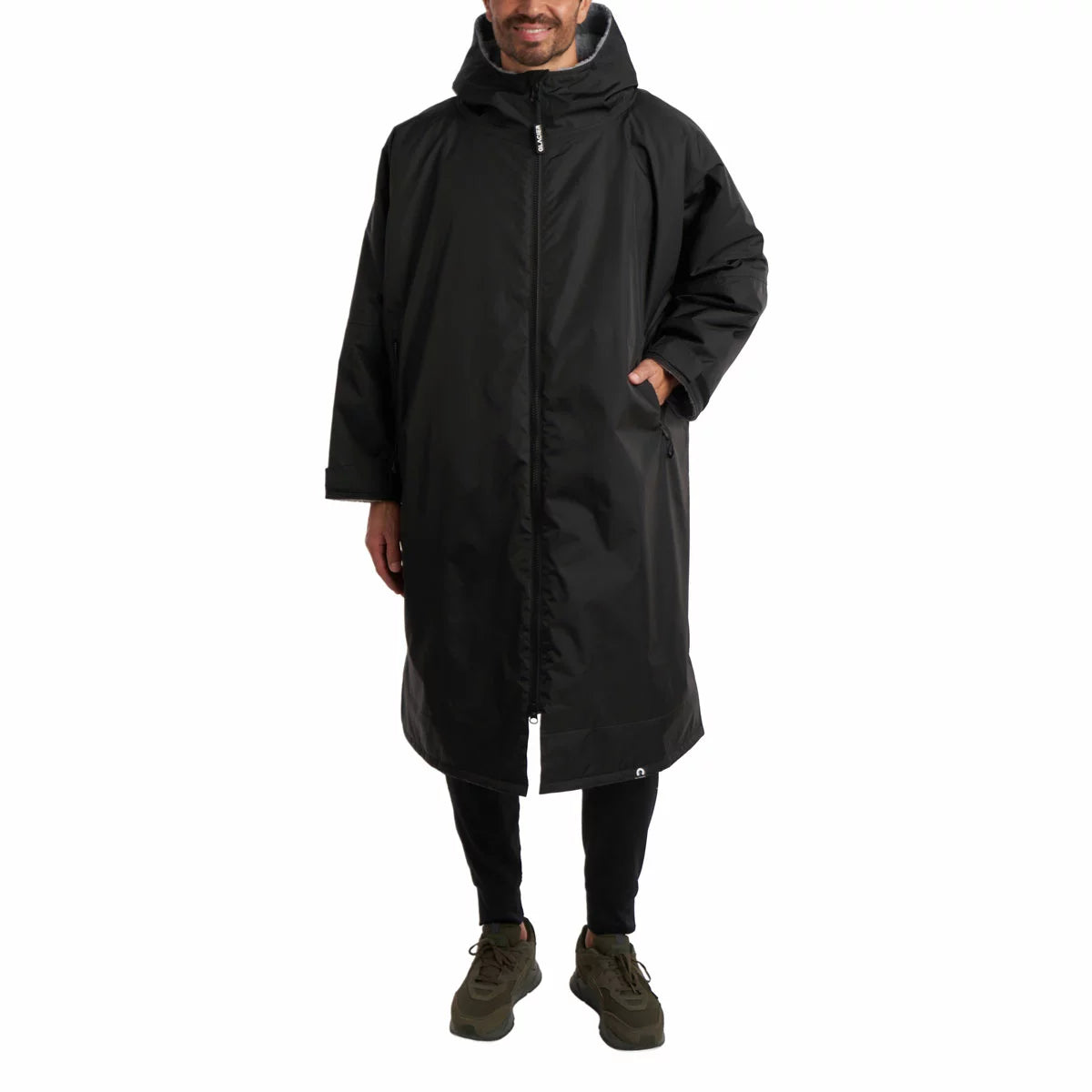 Front view of the black Glacier unisex outdoor waterproof robe featuring a deep fleece lining and full length zipper on a neutral background.