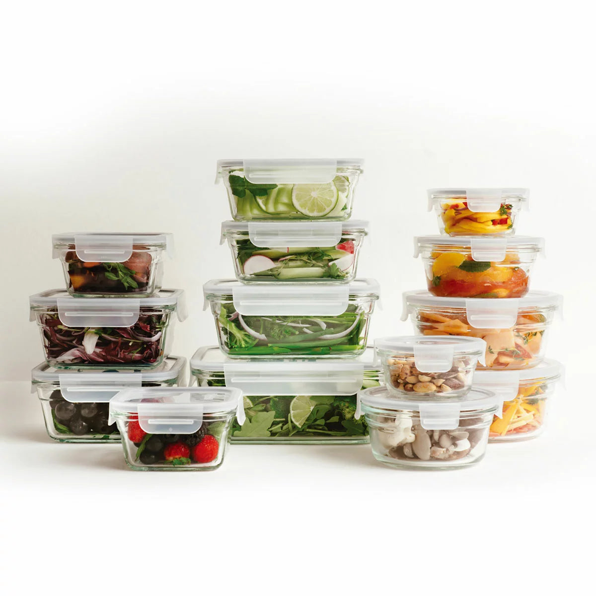 Glasslock 28-piece tempered glass food storage set neatly arranged on a modern kitchen counter.
