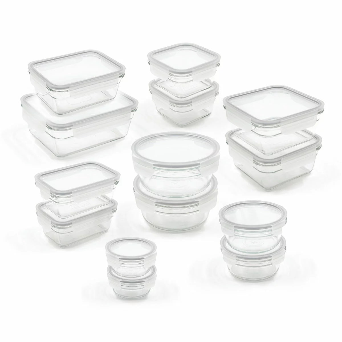 Glasslock 28-piece tempered glass food storage set neatly arranged on a modern kitchen counter.