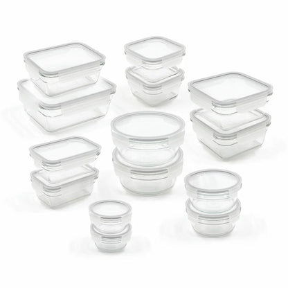 Glasslock 28-piece tempered glass food storage set neatly arranged on a modern kitchen counter.