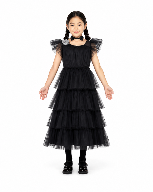 Front angle shot of a child sized 5-6 wearing a floor-length black gothic queen dress with lace bell sleeves and ruffled skirts.