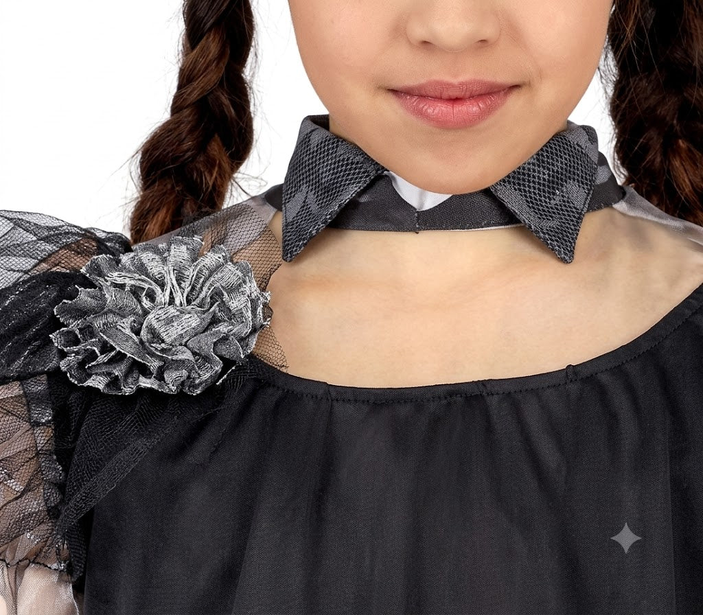 Front angle shot of a child sized 5-6 wearing a floor-length black gothic queen dress with lace bell sleeves and ruffled skirts.