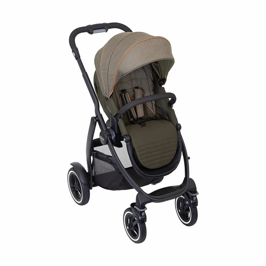 Graco Evo XT stroller in profile showing the extended wheelbase, multi-terrain tires, and protective mudguards on a rugged trail.