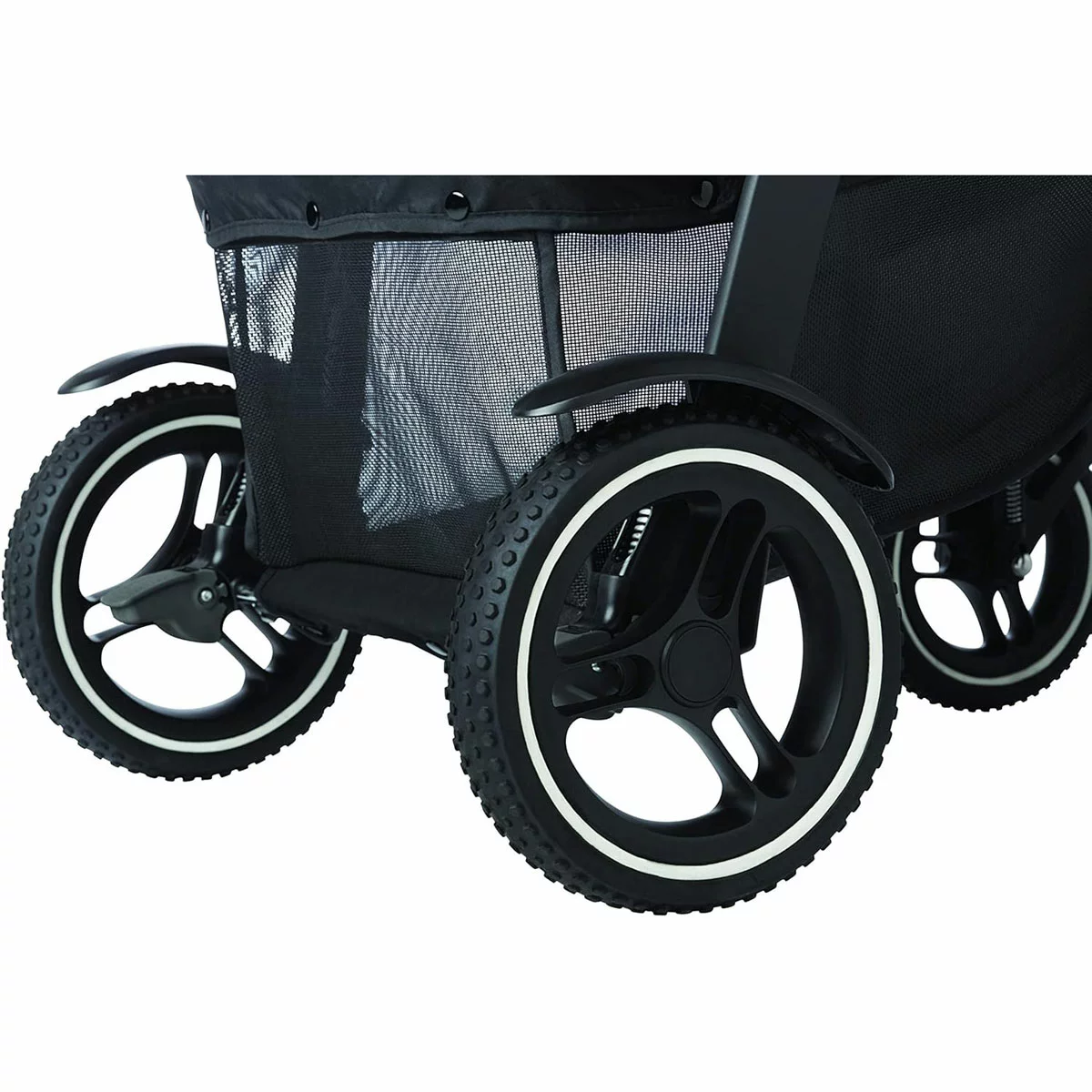 Graco Evo XT stroller in profile showing the extended wheelbase, multi-terrain tires, and protective mudguards on a rugged trail.