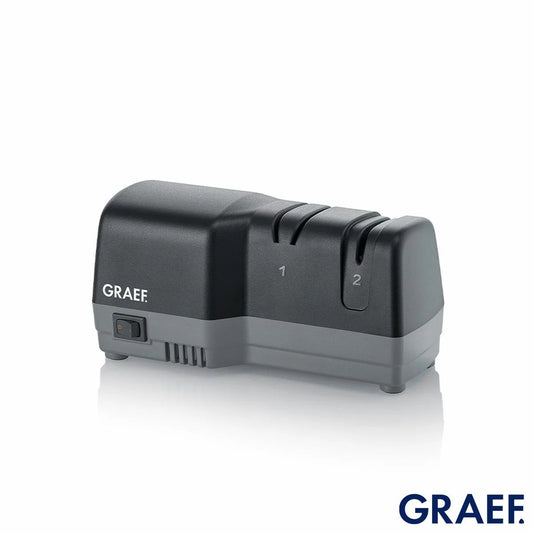 Side angle view of the black Graef CC82UKI Electric Knife Sharpener sitting on a wooden countertop with its 20 degree angle guide slots visible.