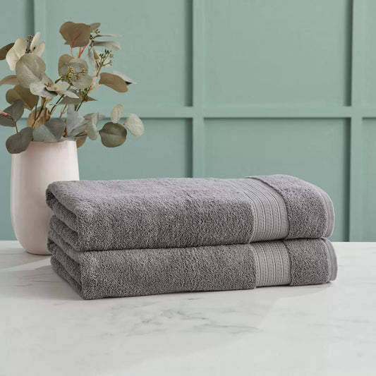 Two neatly folded Grandeur 100% cotton grey bath sheets showing plush texture and premium stitching.