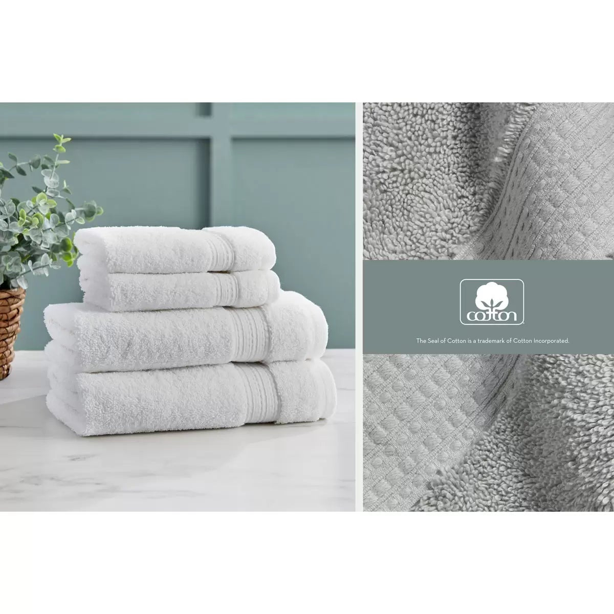 Pair of thick, folded dark grey 100% HYGROCOTTON bath towels displaying dense 708 GSM pile texture stacked on a white marble vanity.
