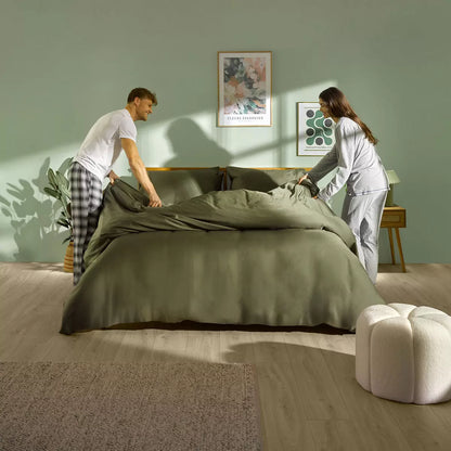 Panda Signature+ green bamboo lyocell bedding set draped smoothly on a bed highlighting silky satin weave finish, fitted sheet, and matching pillowcases.