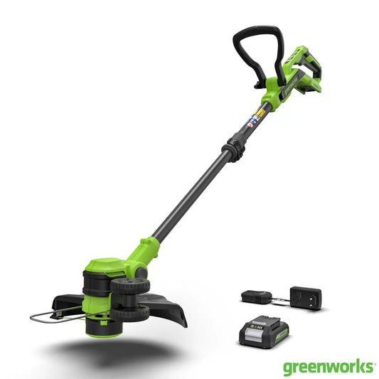 Greenworks 24V brushless cordless line trimmer with 30cm cutting head being used to edge a garden lawn.