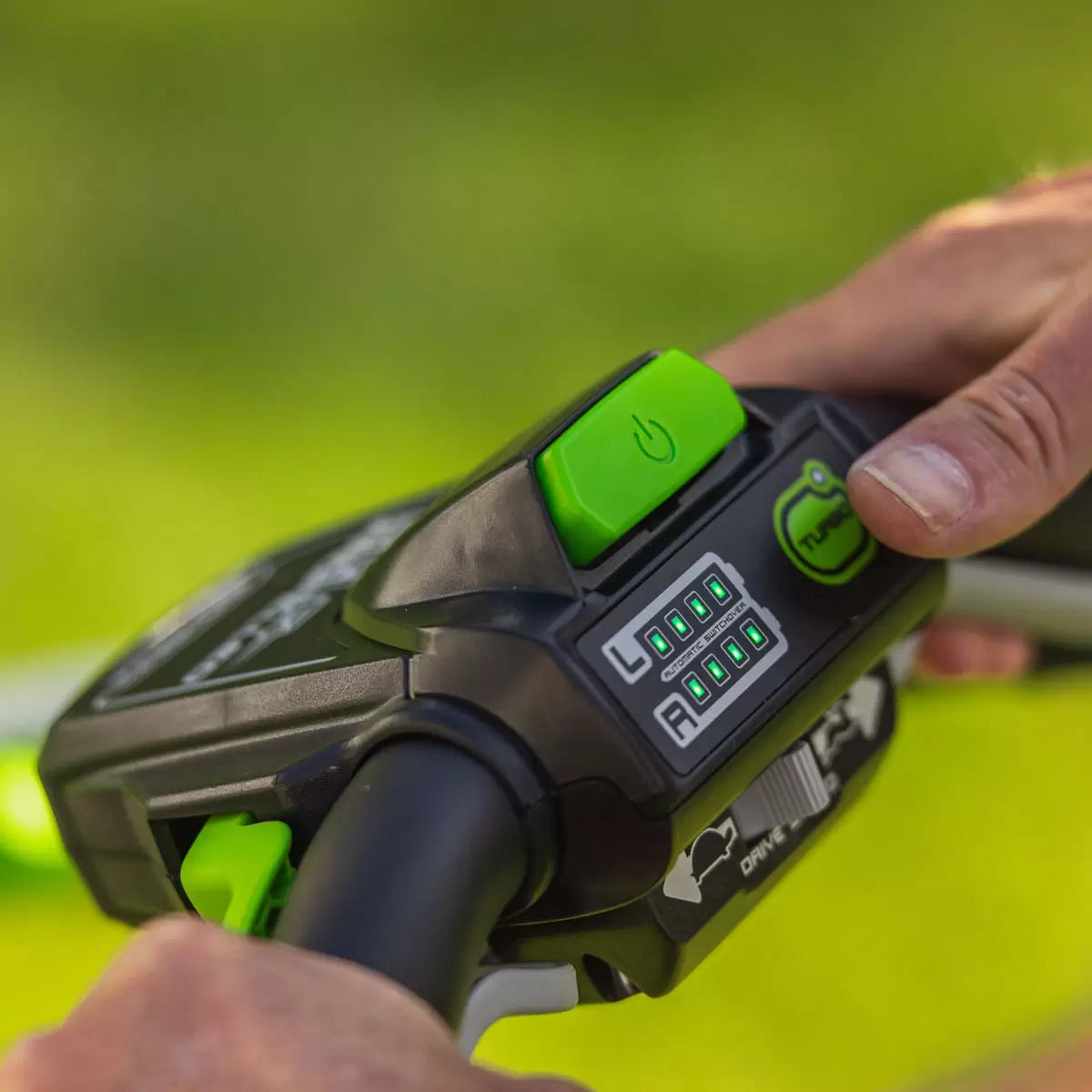 Greenworks 60V 46cm self-propelled cordless lawnmower with 4Ah battery mowing a large residential garden