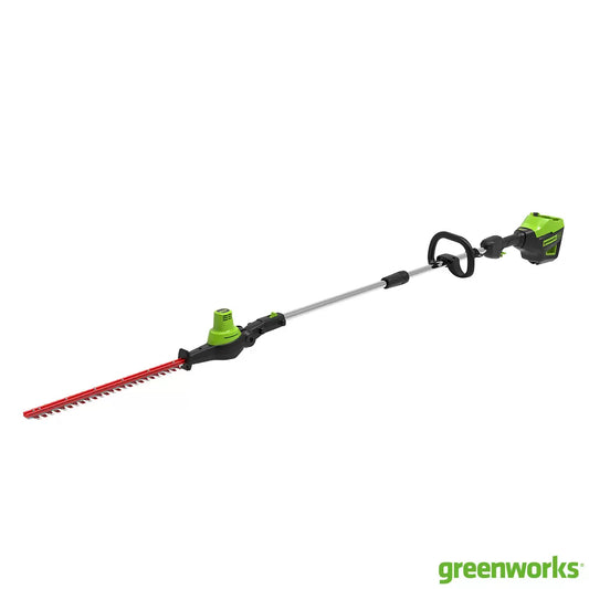 Greenworks 60V DigiPro cordless long-reach hedge trimmer with a 51cm blade being used on a tall garden hedge.