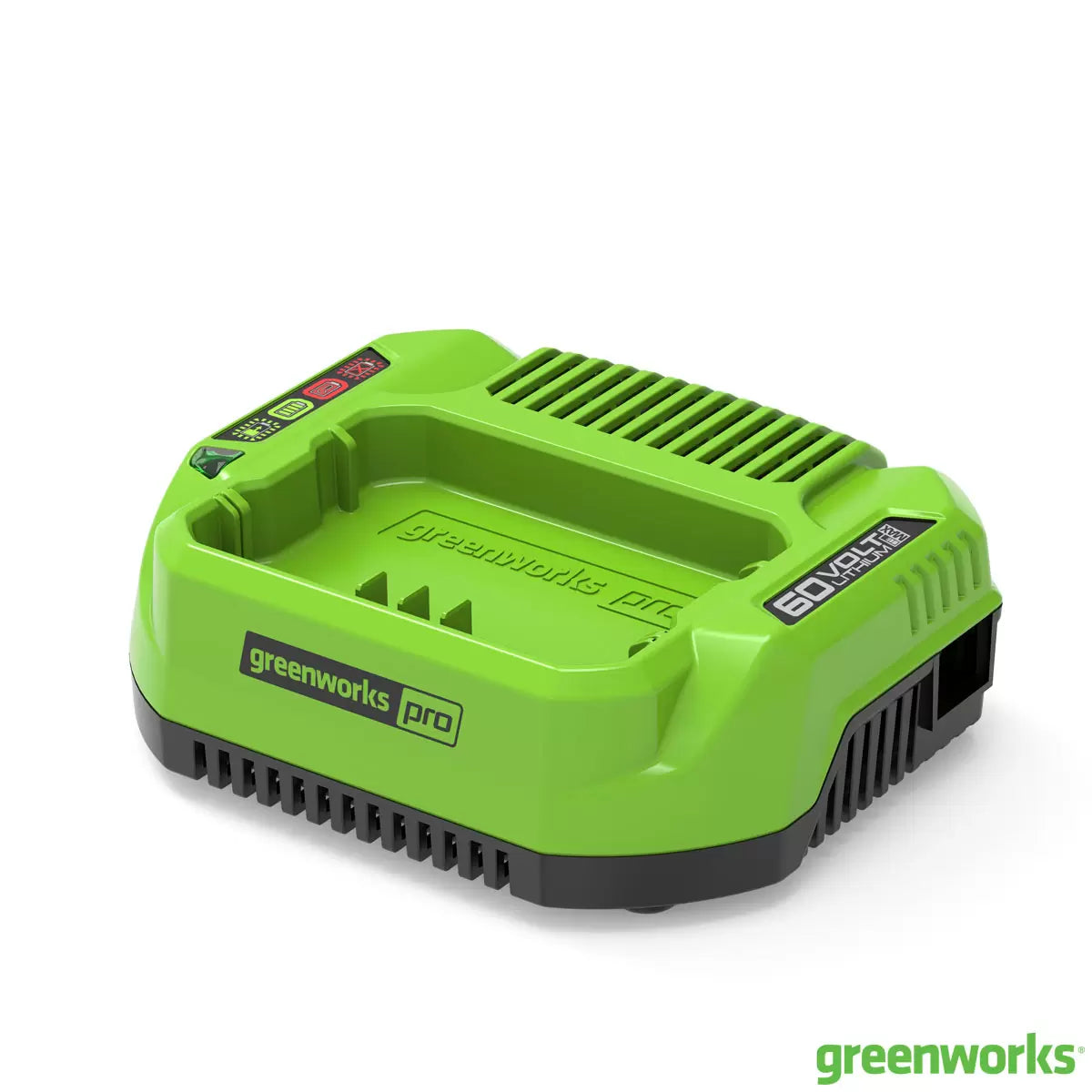 Greenworks 60V rapid battery charger with LED indicator lights and plugged-in cord on a workbench.