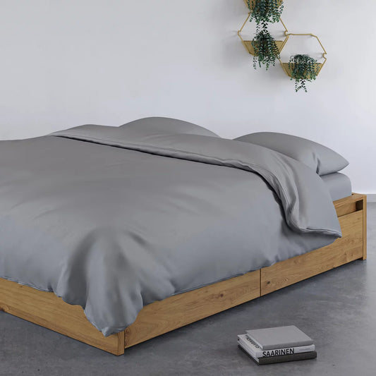 Panda 100% bamboo grey duvet cover set laid neatly on a bed showcasing cashmere-soft texture, natural bamboo button closures, and matching pillowcases.