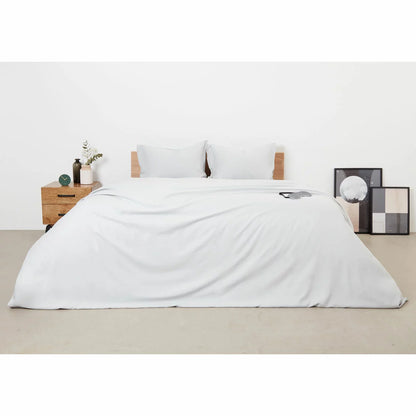 Panda Grey Bamboo and French Linen Duvet Cover Set on a bed featuring crisp matte texture, Oxford pillowcase edges, and raw bamboo buttons.