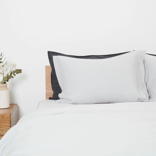 Panda Grey Bamboo and French Linen Duvet Cover Set on a bed featuring crisp matte texture, Oxford pillowcase edges, and raw bamboo buttons.
