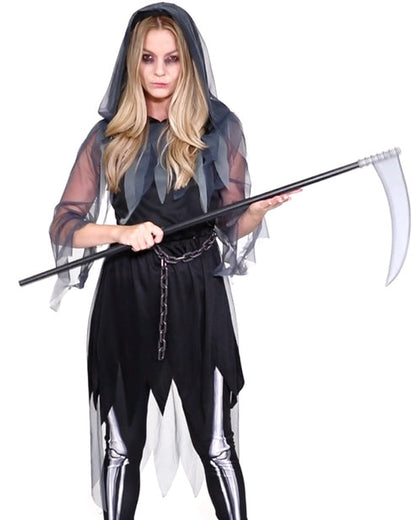 Front view of a woman wearing the dark hooded Grim Reaper Lady Adult Costume with floor-length flowing sleeves against a dark background.