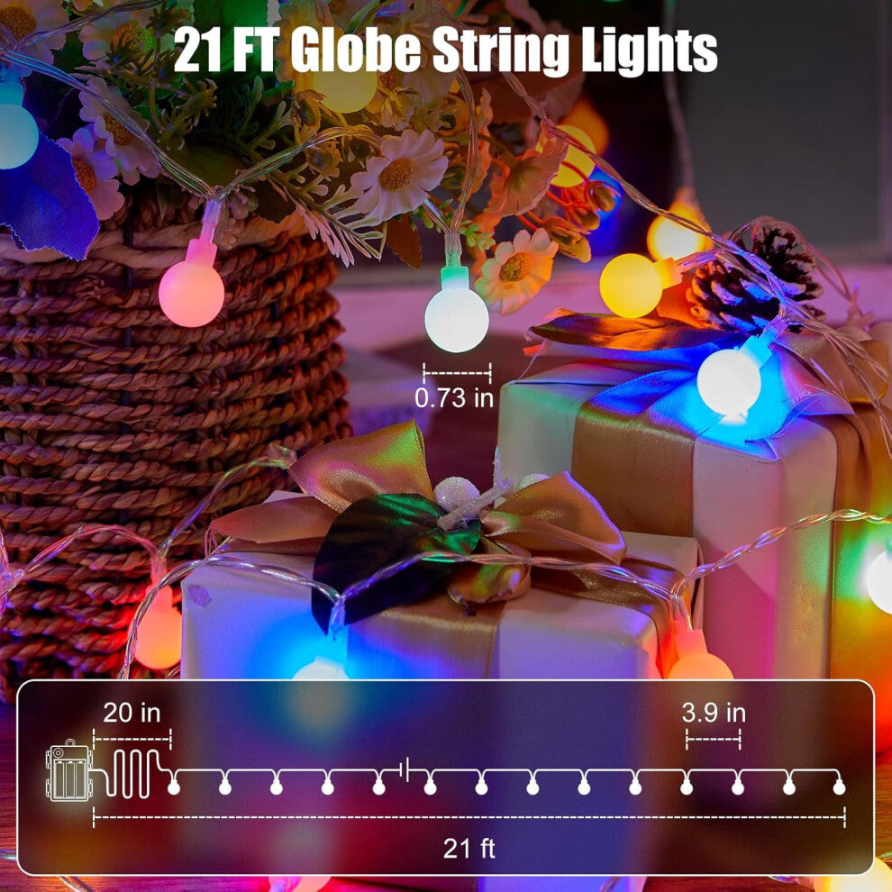 A string of 30 green LED eyeball lights glowing with eerie 3D realism along an outdoor porch railing.