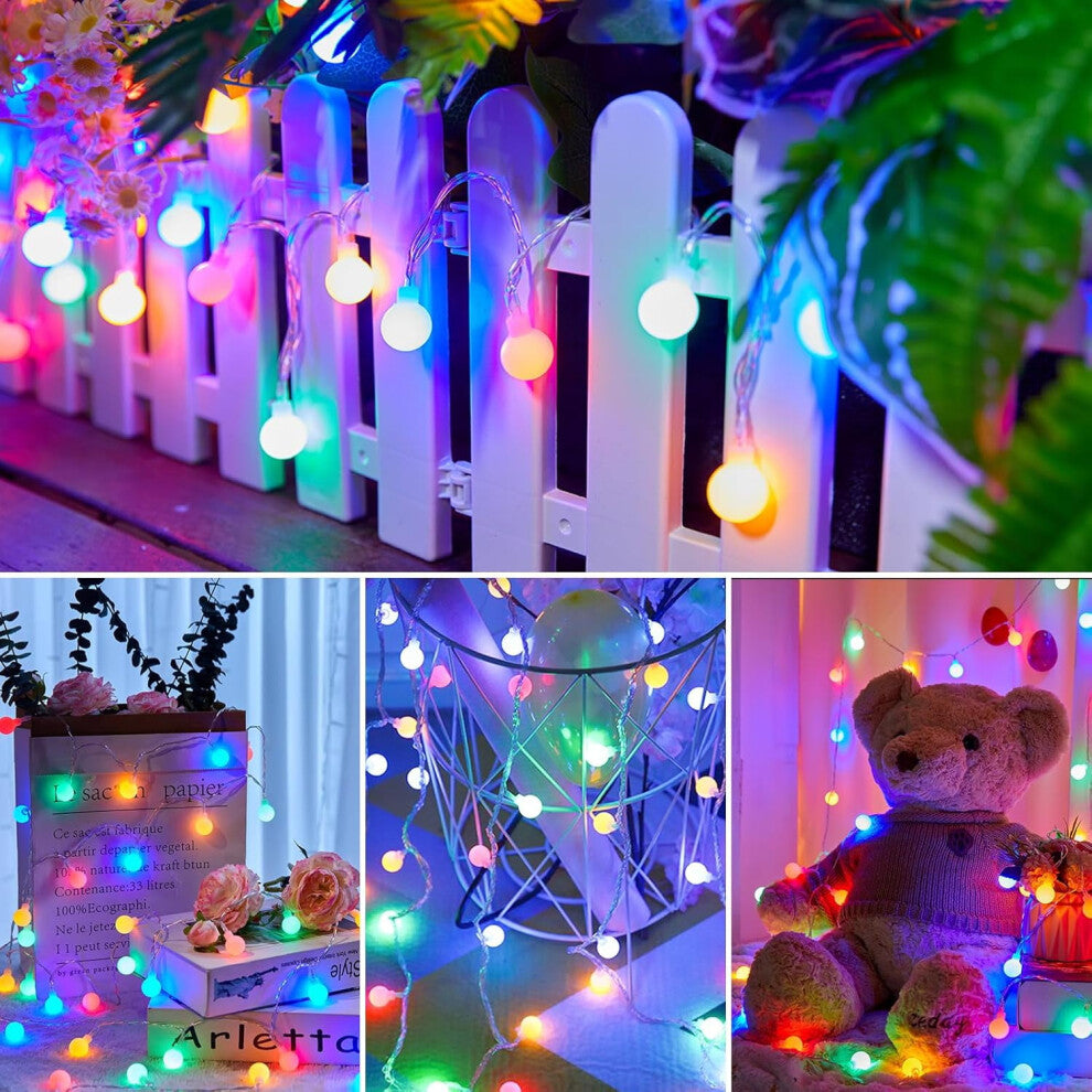 A string of 30 green LED eyeball lights glowing with eerie 3D realism along an outdoor porch railing.