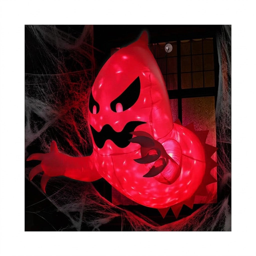 White polyester 4.6-foot inflatable Halloween ghost with internal red LED light bursting out of a house window frame at night.