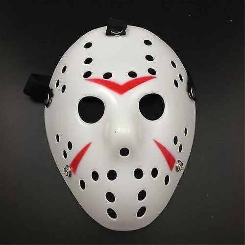 Front view of an iconic white and red painted Jason Voorhees Friday the 13th scary hollow out plastic mask on a dark background.