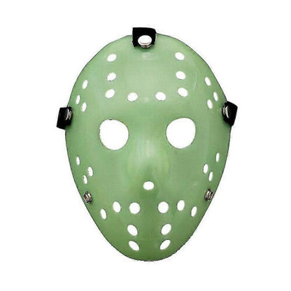 Front view of an iconic white and red painted Jason Voorhees Friday the 13th scary hollow out plastic mask on a dark background.