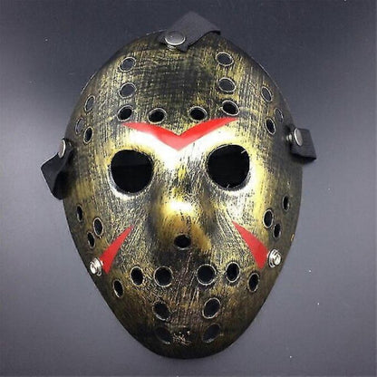 Front view of an iconic white and red painted Jason Voorhees Friday the 13th scary hollow out plastic mask on a dark background.