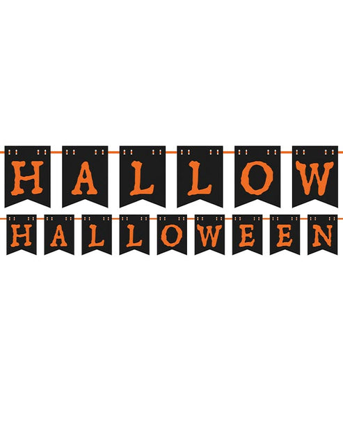 Black and orange 2.2m Halloween letter banner hanging flat against a dark interior wall above a lit pumpkin display.