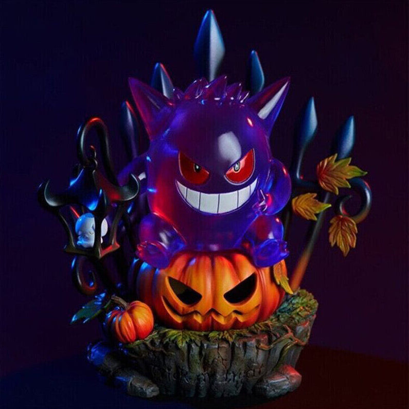 A handmade resin Gengar King figurine sitting atop an illuminated Halloween pumpkin LED light on a dark desk.