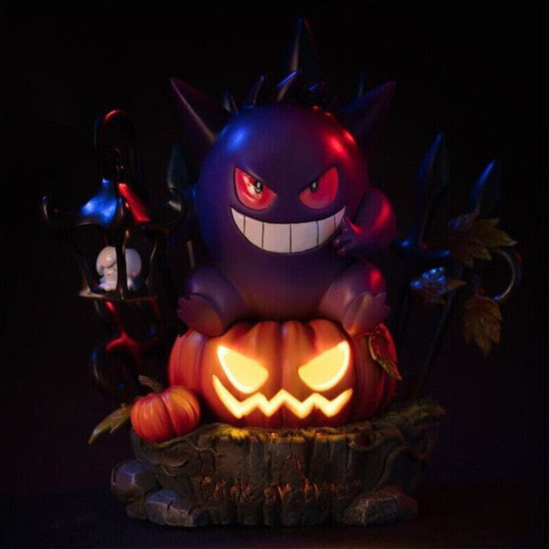 A handmade resin Gengar King figurine sitting atop an illuminated Halloween pumpkin LED light on a dark desk.