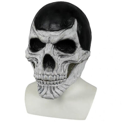 Front view of a full-head black skull costume mask with a realistic articulated moving jaw against a dark studio background.
