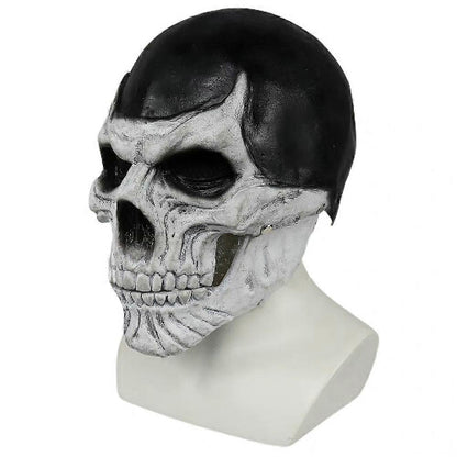 Front view of a full-head black skull costume mask with a realistic articulated moving jaw against a dark studio background.
