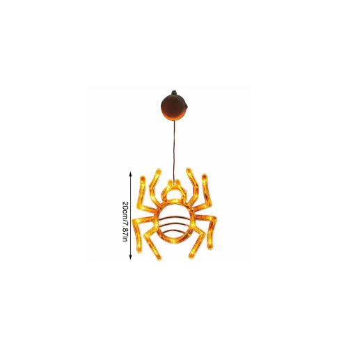 An illuminated Halloween window LED light with a suction cup glowing brightly against a glass pane at night.