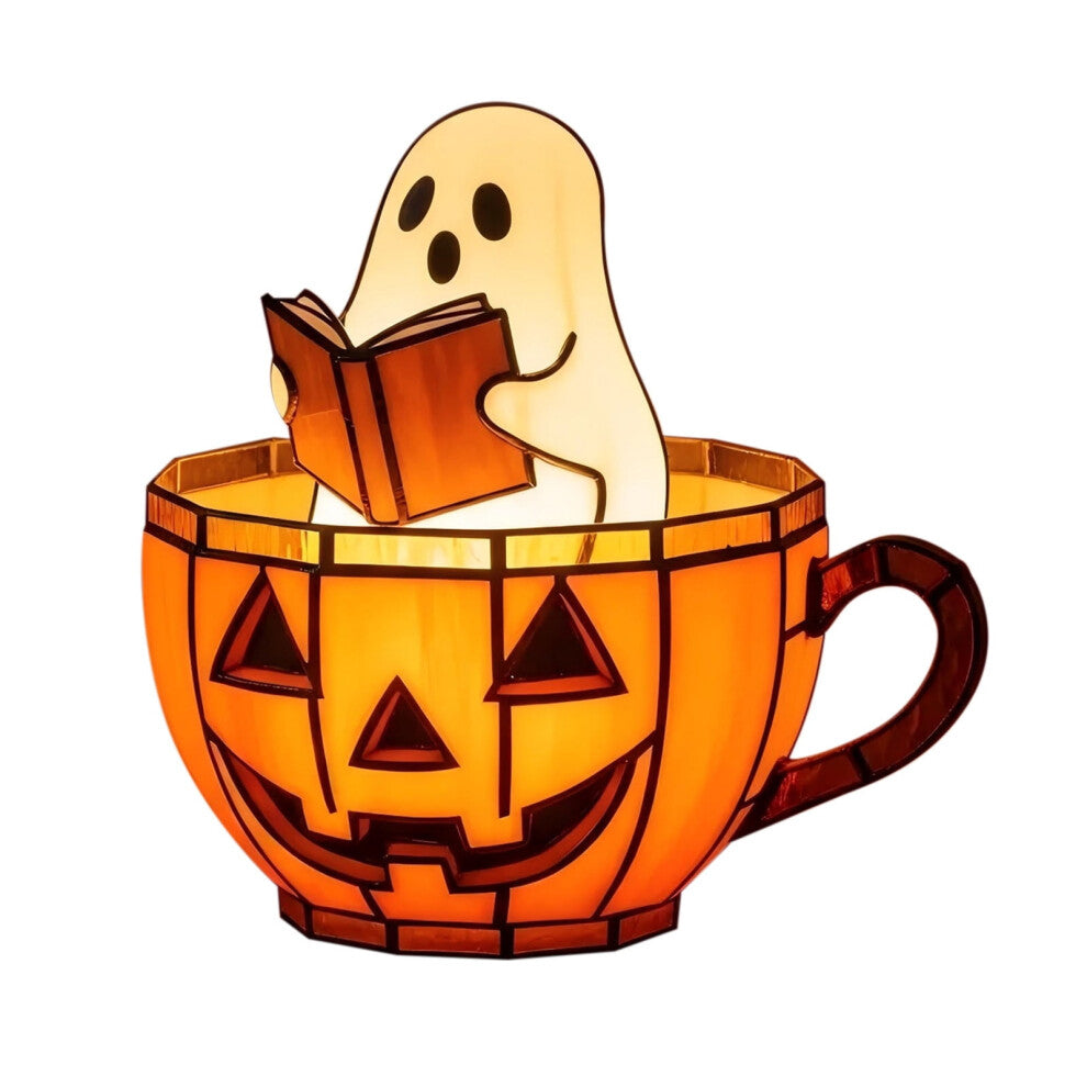 A handmade ghost reading a book lamp glowing with soft color-changing light on a wooden bookshelf decorated for Halloween.