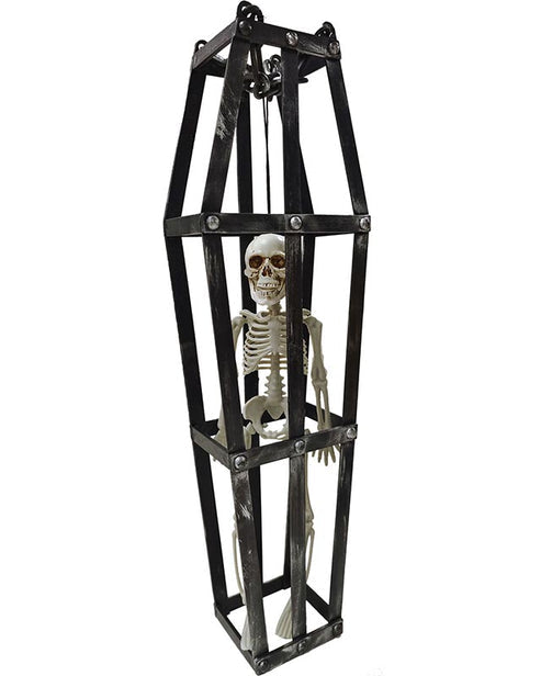 Front view of a 40cm bone-white plastic skeleton trapped in a black cage, hanging against a dark background for Halloween decor.
